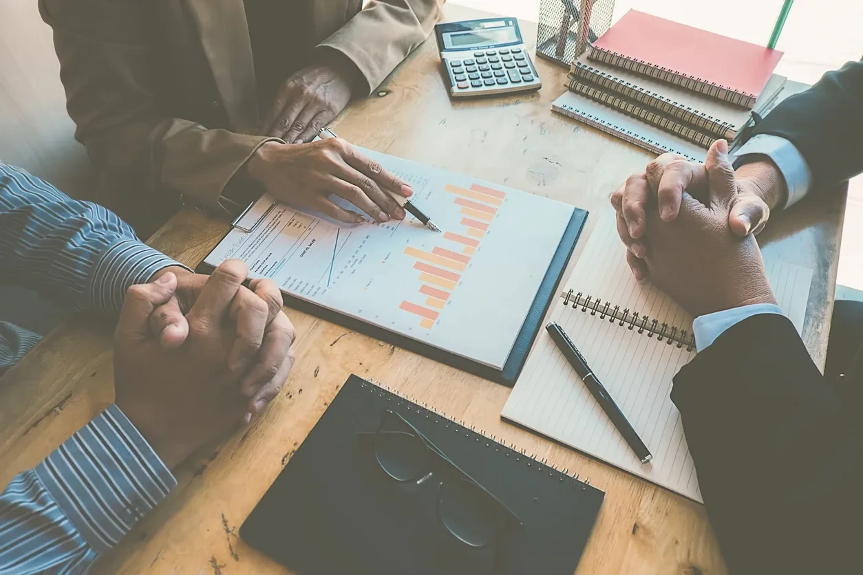 Professionals discussing a business report